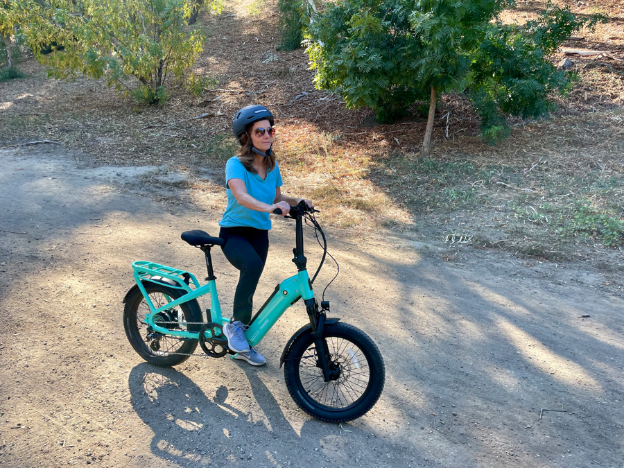 Woman riding the Ride1Up Portola Electric Bike