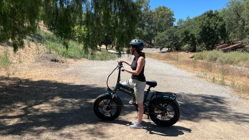 Woman sitting on the Engwe Engine Pro 2.0 Full Suspension electric bike