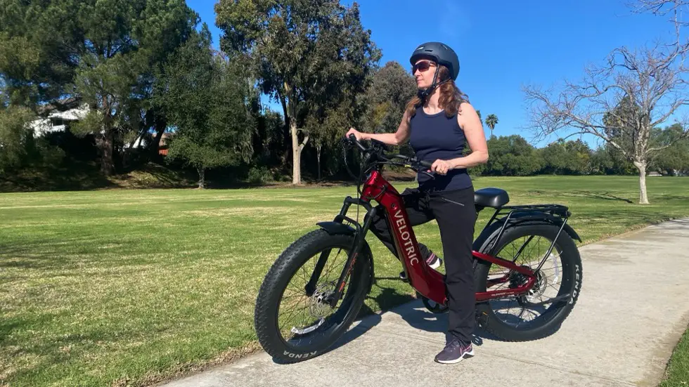 Woman sitting on Velotric Nomad 2 Review